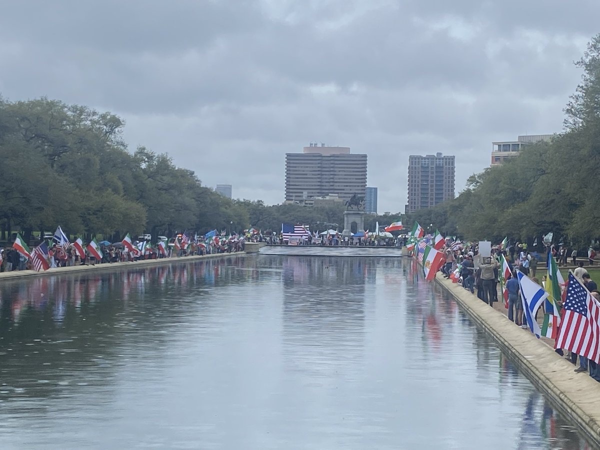 mojtaba45332206's tweet photo. Iranians in Houston standing strong along the iconic reflecting pool — waving 🇺🇸 American flags, pre-revolution 🇮🇷 Lion & Sword flags, and flags of solidarity — in massive support for the people of Iran and the fall of the terrorist regime.  

This is NOT just a rally; it's a declaration: Freedom is coming. The people have spoken — the regime's days are numbered!  

تجمع عظیم ایرانیان هیوستون کنار حوضچه زیبای هرمان پارک — با پرچم‌های آمریکا، شیر و خورشید، و پرچم‌های همبستگی — در حمایت قاطع از مردم ایران و سقوط رژیم تروریست.  

این فقط یک تجمع نیست؛ اعلامیه است: آزادی نزدیک است. مردم حرف آخر را می‌زنند — روزهای رژیم به پایان رسیده!  

#IraniansStandWithIran #HoustonStrong #FreeIran #KingRezaPahlavi #ThankYouTrump #MEKterrorist #JavidShah
@FreeIranHouston