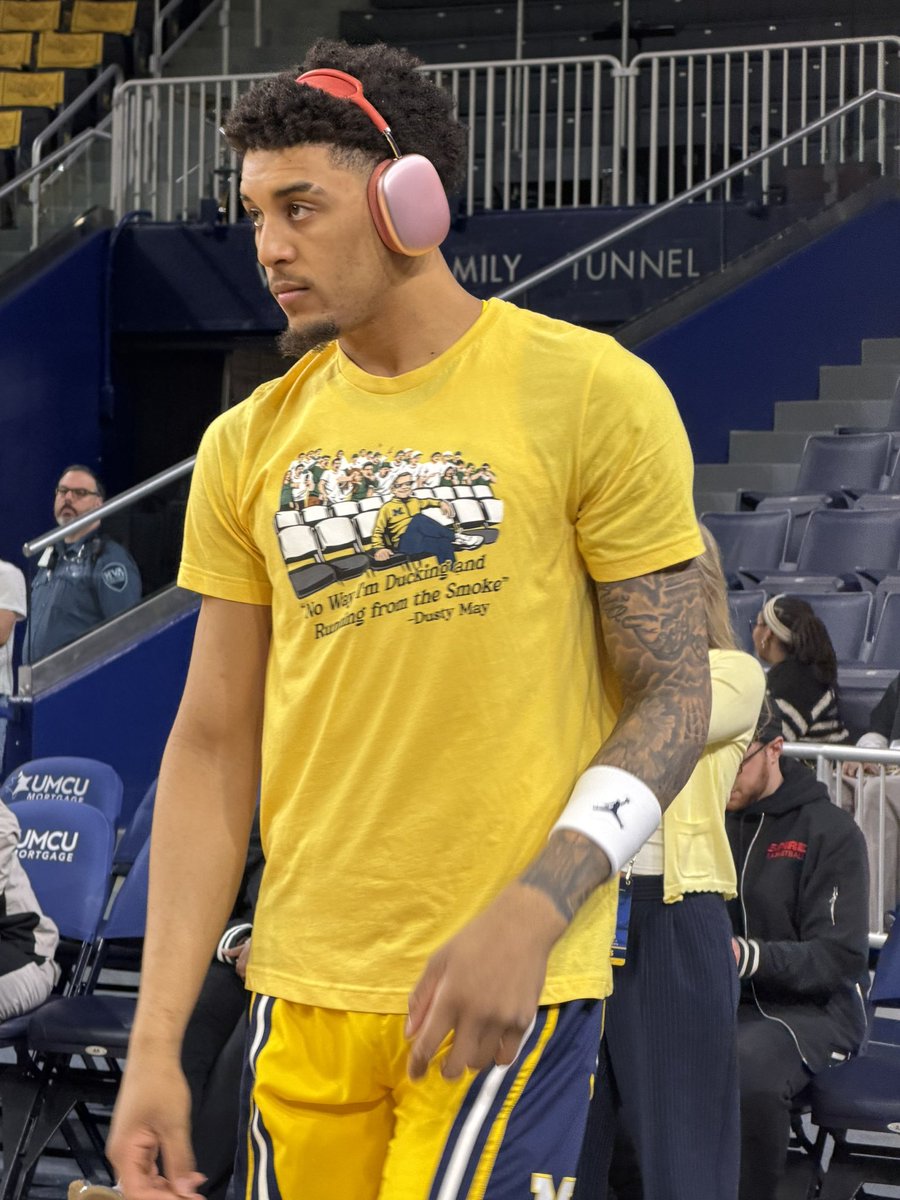Yaxel Lendeborg warming up in the Dusty May/Izzone shirt