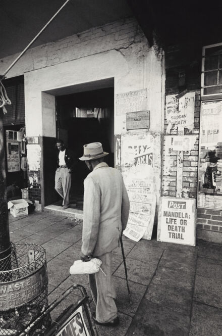HistorySAZAR's tweet photo. 1963: Newspaper banner in Diagonal Street, Johannesburg, during the Rivonia Trial. Photo Credit: David Goldblatt https://t.co/69tpS8qBok