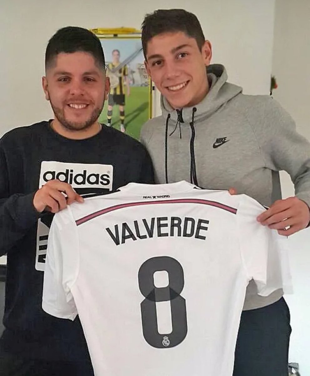 theMadridZone's tweet photo. Fede Valverde holding a Real Madrid #8 jersey from 2014/15. 

Two years before he even signed for Real Madrid. 🔙🤯🤍 https://t.co/G4kdPu1Fjl