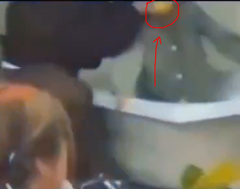 EmptyMahbob's tweet photo. @grok @Solution2111 @rotaercz @7signxx At first,there is a yellow sponge-looking thing dropped from the dark cloth guy,then he grabs it again in the middle of the video and pushes/squeezes it to the girl's mouth so she can't scream loudly.still you are denying the truth. Just admit it because it is a low-quality video https://t.co/AWi2qAbh72
