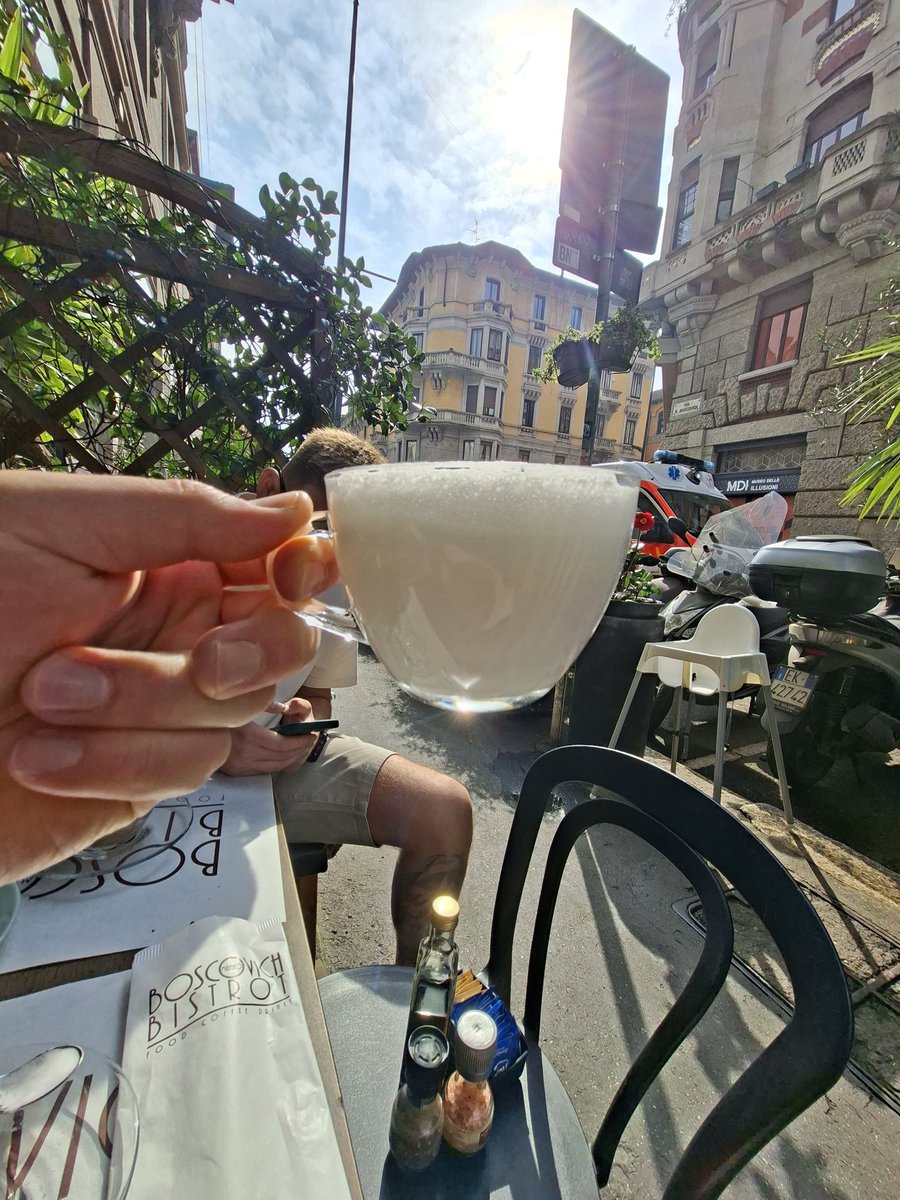 Orders a latte in Italy and gets a cup of warm milk