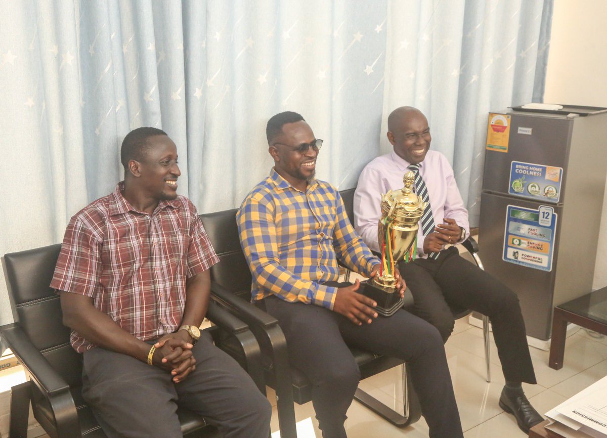 GAECGH's tweet photo. Team GAEC presented the NRA GAEC Games trophy to Management following their victory in the 2nd edition of the competition. The trophy was received on behalf of the Director General by the Deputy Director General and the Director of Administration. Congratulations to the team https://t.co/8RKFAGvQTy