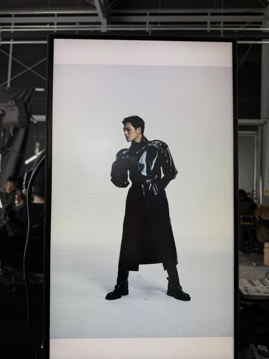 Eyes down, presence up. Obsidian trench catching every light in the room. Built different, styled sharper.