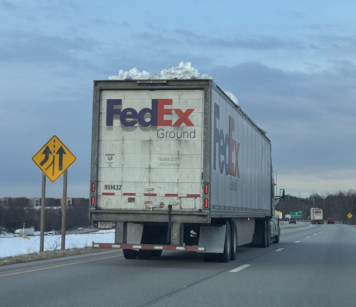 CurtGenesse's tweet photo. @FedEx @FedExHelp this could kill another driver.  Trailer has a foot of hard snow on top of it.  Truck #155214 from cab. https://t.co/yvzXIkW1zT