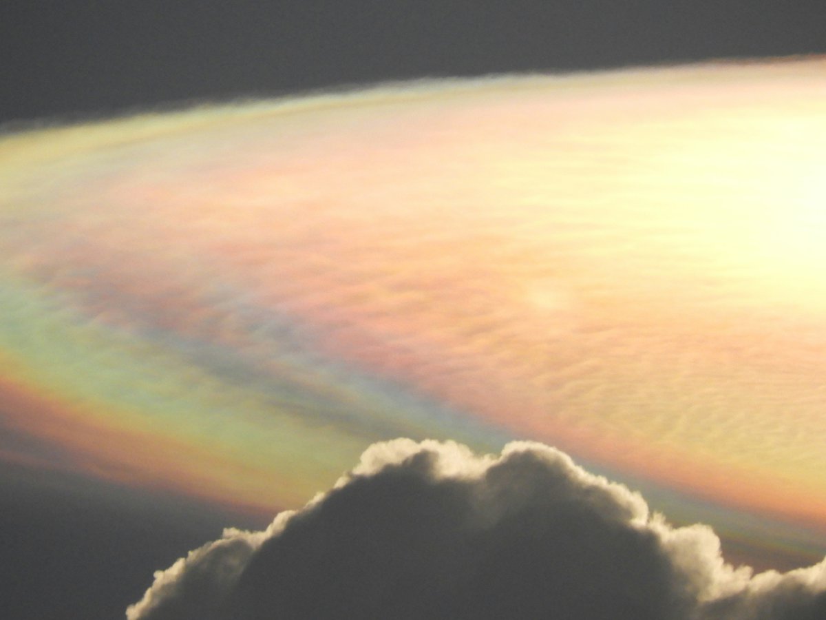 CloudAppSoc's tweet photo. Cloud iridescence produced by Cirrocumulus undulatus clouds spotted above the Maasai Mara National Reserve, Kenya by Athena Blyth (Member 52,729). https://t.co/6bEVkRjYtX