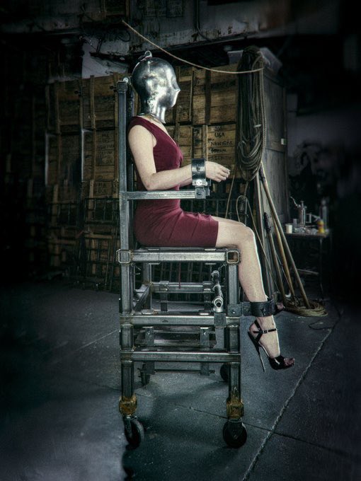 DarkSatanatrix's tweet photo. A pretty red dress and Louboutins don’t make you less of furniture. Strapped, masked and mounted exactly where decorative things belong 😈  Stay quiet, stay useful. 💅 https://t.co/pyVQxQZlIG