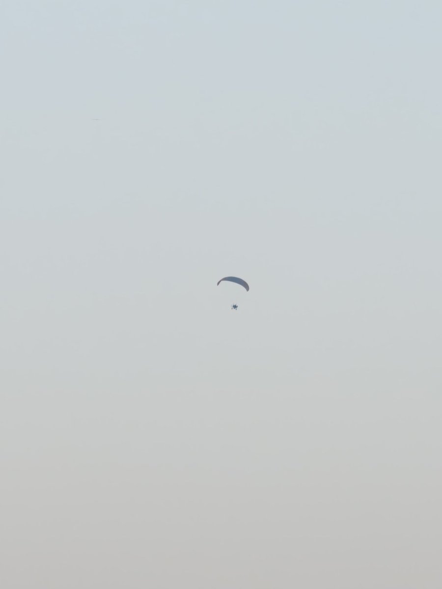 Took a picture of this paraglider today and it just looks like a minimalist illustration of Adolf Hitler