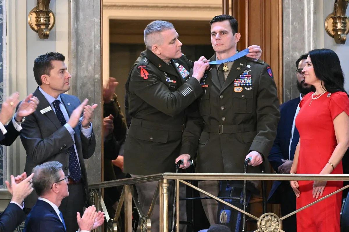 KTB_500's tweet image. Moments like this—watching **LTG Jonathan Braga** place the Medal of Honor around **CW5 Eric Slover**'s neck in the gallery during President Trump's State of the Union—hit deep in the chest. They remind every Soldier, every one of us who's ever laced up boots and stepped into the