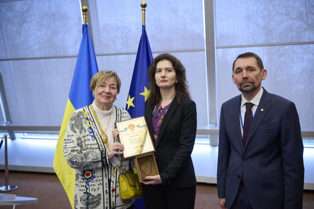 UKRinCoE's tweet photo. On 25 February, marking the 4th anniversary of Russia’s full-scale war against Ukraine, the exhibition “THANK YOU WITH ALL MY HEART” opened at the Council of Europe.

At its center — the Great Amber Heart of Ukraine, rescued in Bucha.
Author of the Heart project — Halyna Symkha.

Amber Heart replicas, as distinctions of gratitude, were presented to Secretary General @alain_berset and Ambassador Daniela Cujba @MoldovaCoE.

Music by Ukrainian maestro Mike Kaufman-Portnikov — including a piece dedicated to the Amber Heart — shaped the atmosphere of remembrance and gratitude.

#StandWithUkraine 🇺🇦