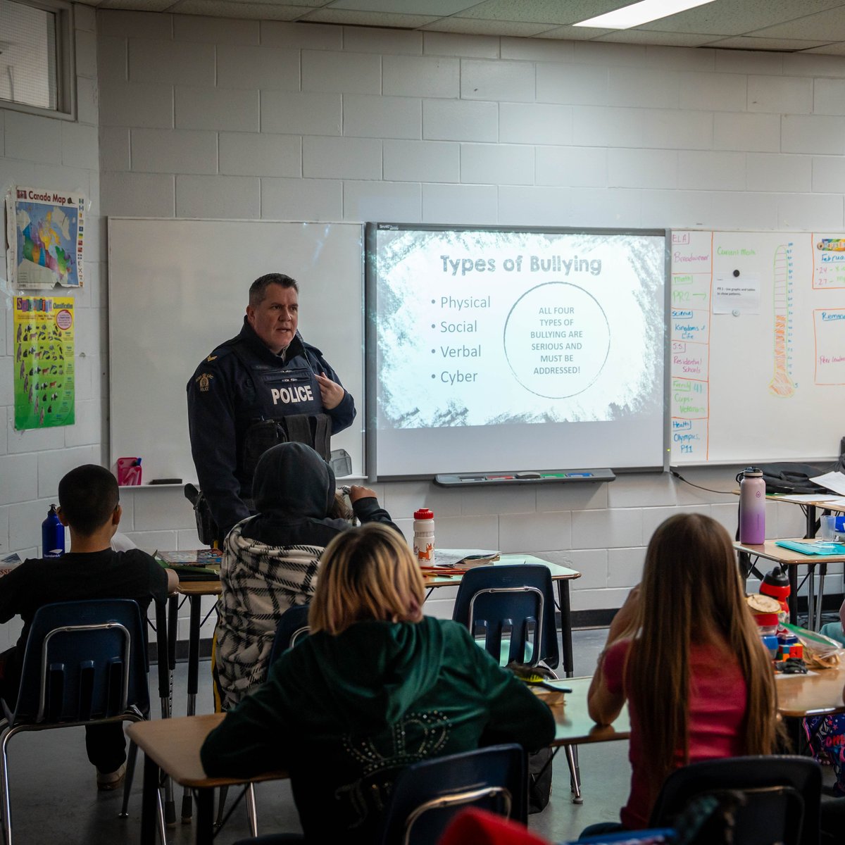 rcmpmb's tweet photo. Cpl Sundell & Cst Smith had an awesome time visiting La Vérendrye School for #PinkShirtDay! They chatted with students about standing up to bullying & reminded everyone that we all have a role to play—small actions can make a big difference. #SprinkleKindness #rcmpmb https://t.co/DR6Oj285x9