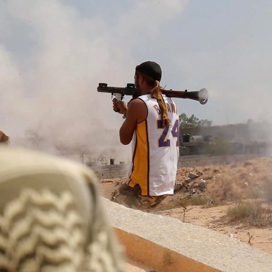 A libyan soldier fighting ISIS while dressed in a Kobe Bryant jersey (2016)