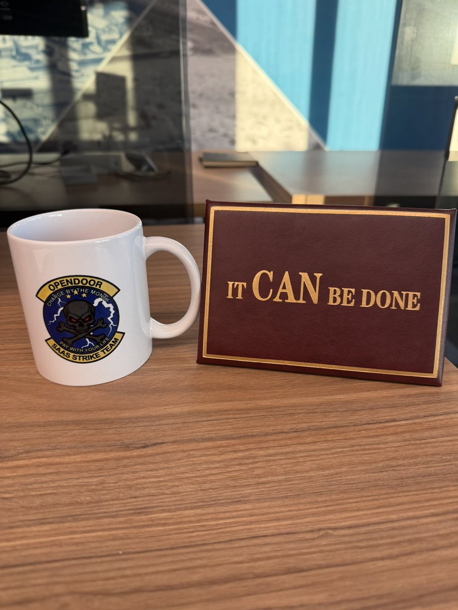 nejatian's tweet photo. Two things on my desk. 

A gift and an homage to President Reagan and our Opendoor SaaS Strike coffee mug. https://t.co/Fa7c0uAgv4