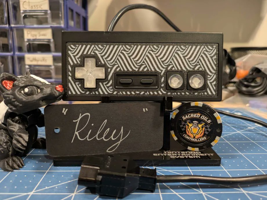 TheSacredOils's tweet photo. "Riley" is available on the website... Or maybe it's just an optical illusion! Complete with an #exHo PCB, new-old-stock Nintendo plug housing, case, and full set of extra rubbers and screws. #SacredOils https://t.co/DXWFQc9fsc https://t.co/wRZEeSTE4Z
