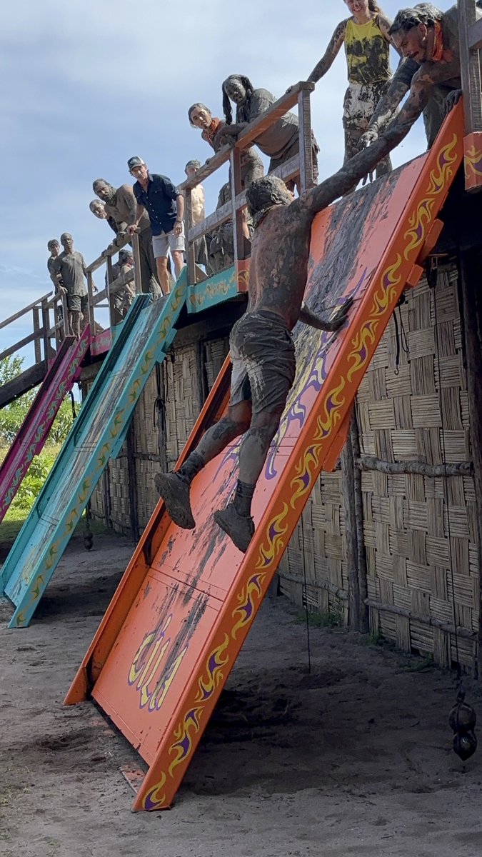 This is seriously one of my favorite photos I have ever taken on location at #Survivor.

Joe and Ozzy locking arms in midair while Probst and all 3 tribes watch from above. EPIC! #Survivor50