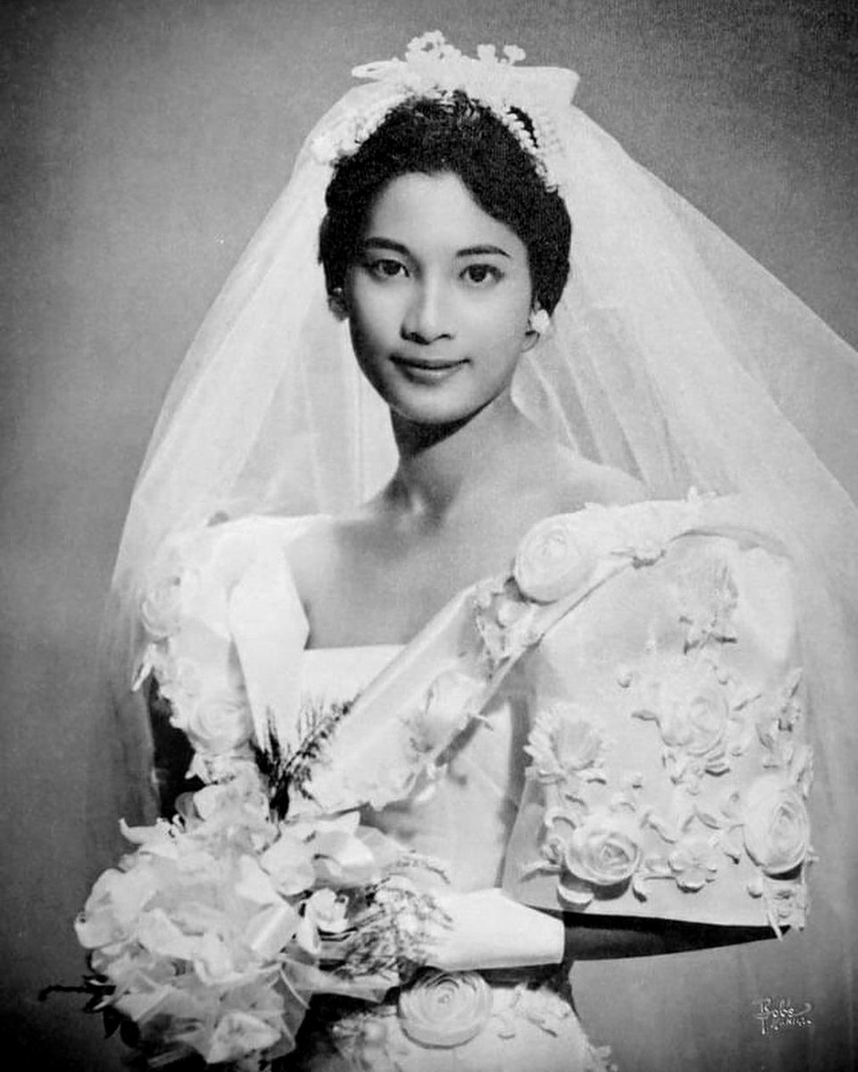 Teresita Tiongson Katigbak in a wedding terno designed by Salvacion Lim Higgins, 1960. Philippines

Short, irregular hemlines were in vogue during the 1950s and 1960s. The pañuelo (kerchief or fichu) remained an essential component of the bridal ensemble.