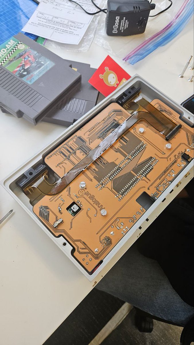 xcubicle's tweet photo. Ancient technology repair from another time. Analogue NT mini is a high end FPGA remake of the orignal Nintendo hardware from the 1980s with HDMI output. This had a broken HDMI which required a trace repair. https://t.co/e7xj6h0TVj