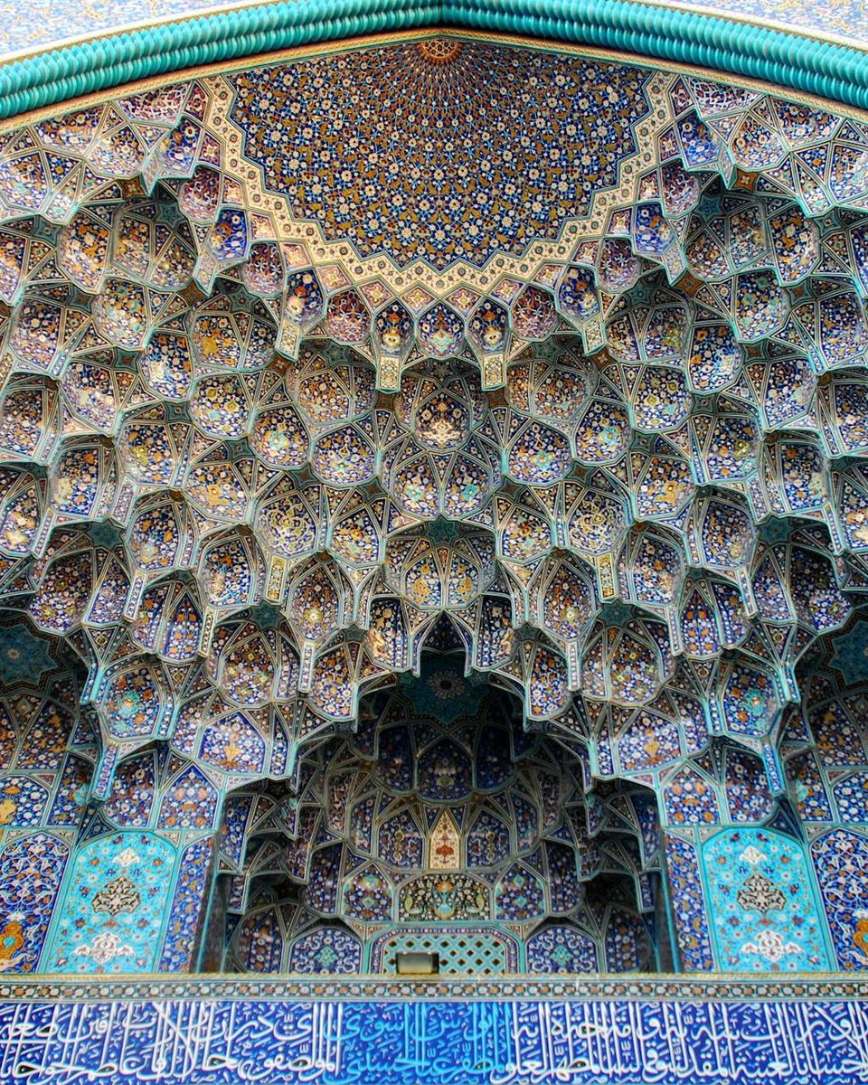 A ceiling that feels infinite. 

This is the muqarnas (honeycomb vaulting) and tilework at Masjed-e Sheikh Lotfollah, Isfahan, Iran—a Safavid masterpiece built under Shah Abbas I in the early 17th century. Every facet is covered in shimmering mosaic and calligraphy, turning