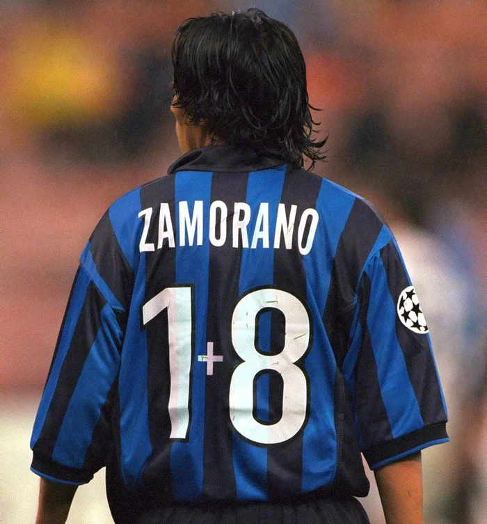 FTBLsection's tweet photo. In 1997, Inter Milan signed Ronaldo and wanted to give him the iconic No. 9 shirt, then worn by Ivan Zamorano. But instead of surrendering his identity, Zamorano made a bold choice and switched to No. 18... 

But with a twist. He hand-stitched a small “+” between the digits, turning it into “1+8.”