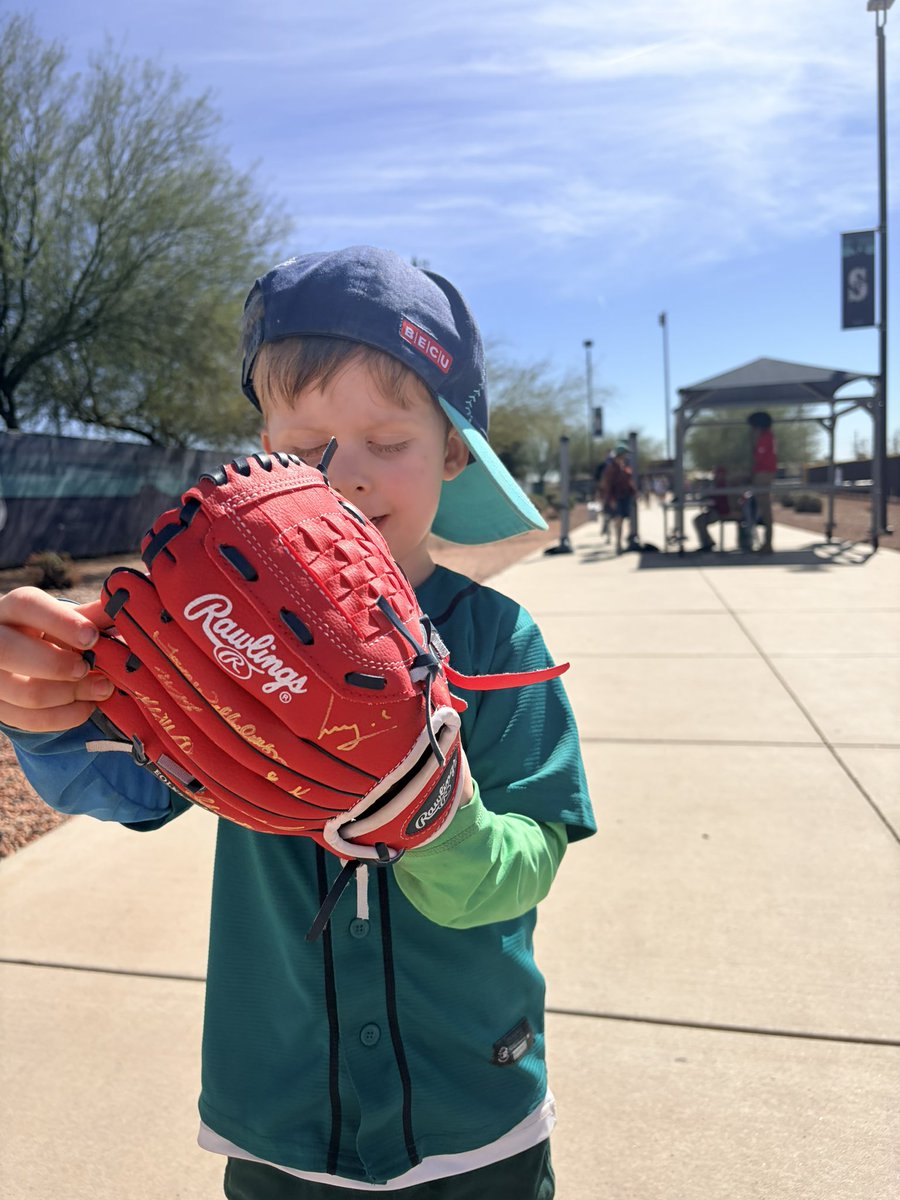 natashamaliab's tweet photo. My son was diagnosed with autism almost two years ago. Something he found love in was baseball. Today at training camp, many players for @Mariners were gracious enough to sign his first glove and man is he excited. We love this team https://t.co/o405zVZqT3