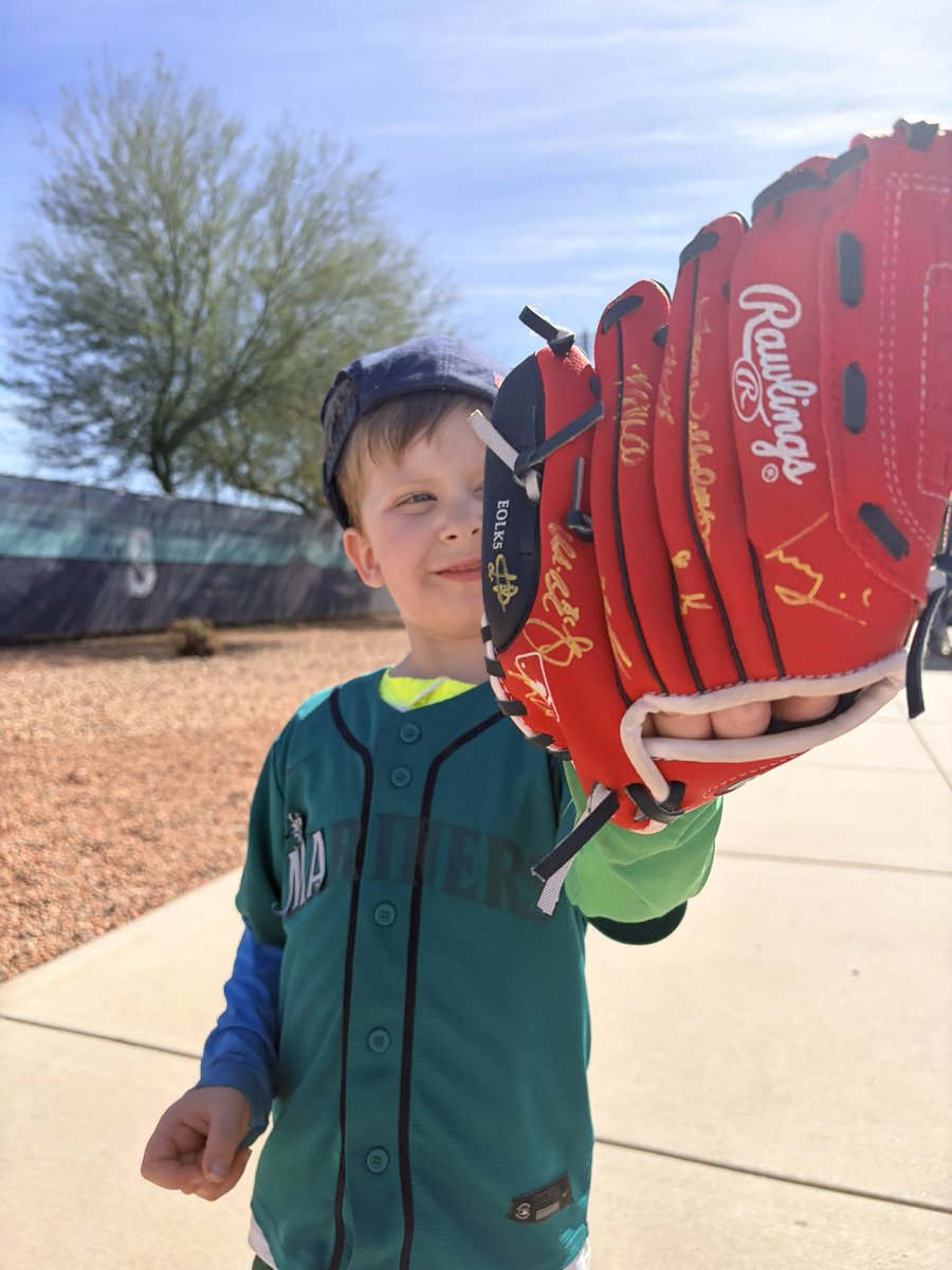 natashamaliab's tweet photo. My son was diagnosed with autism almost two years ago. Something he found love in was baseball. Today at training camp, many players for @Mariners were gracious enough to sign his first glove and man is he excited. We love this team https://t.co/o405zVZqT3
