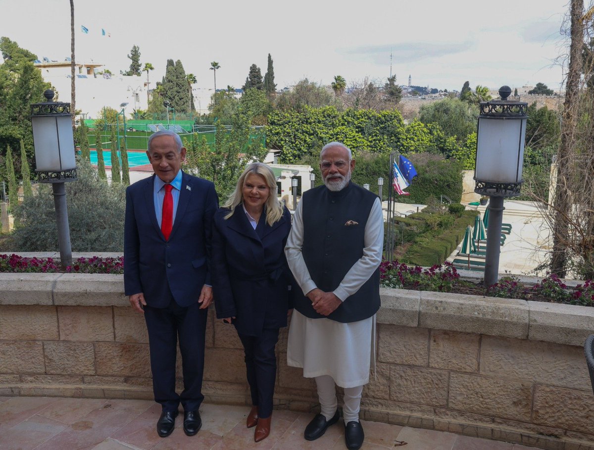 BJP4India's tweet photo. Israeli Prime Minister Netanyahu and his wife extended a warm farewell to PM Modi at Tel Aviv airport as he departed for India, marking the conclusion of a successful and productive two-day visit to Israel. 

Heartwarming visuals from the airport ⬇️ https://t.co/URurfQtg8p