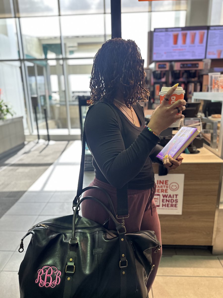 JacksonAirports's tweet photo. She’s booked. 📚✈️
Robyn, a proud Jacksonian, grabbed her favorite read, a sweet wake-me-up from Dunkin’, and took literacy to new heights at JAN.
We're bridging literacy in flight — because every journey should take you somewhere great.
#ReadAcrossAmerica #FlyJAN #BookedAtJAN https://t.co/N7YWefQBkP