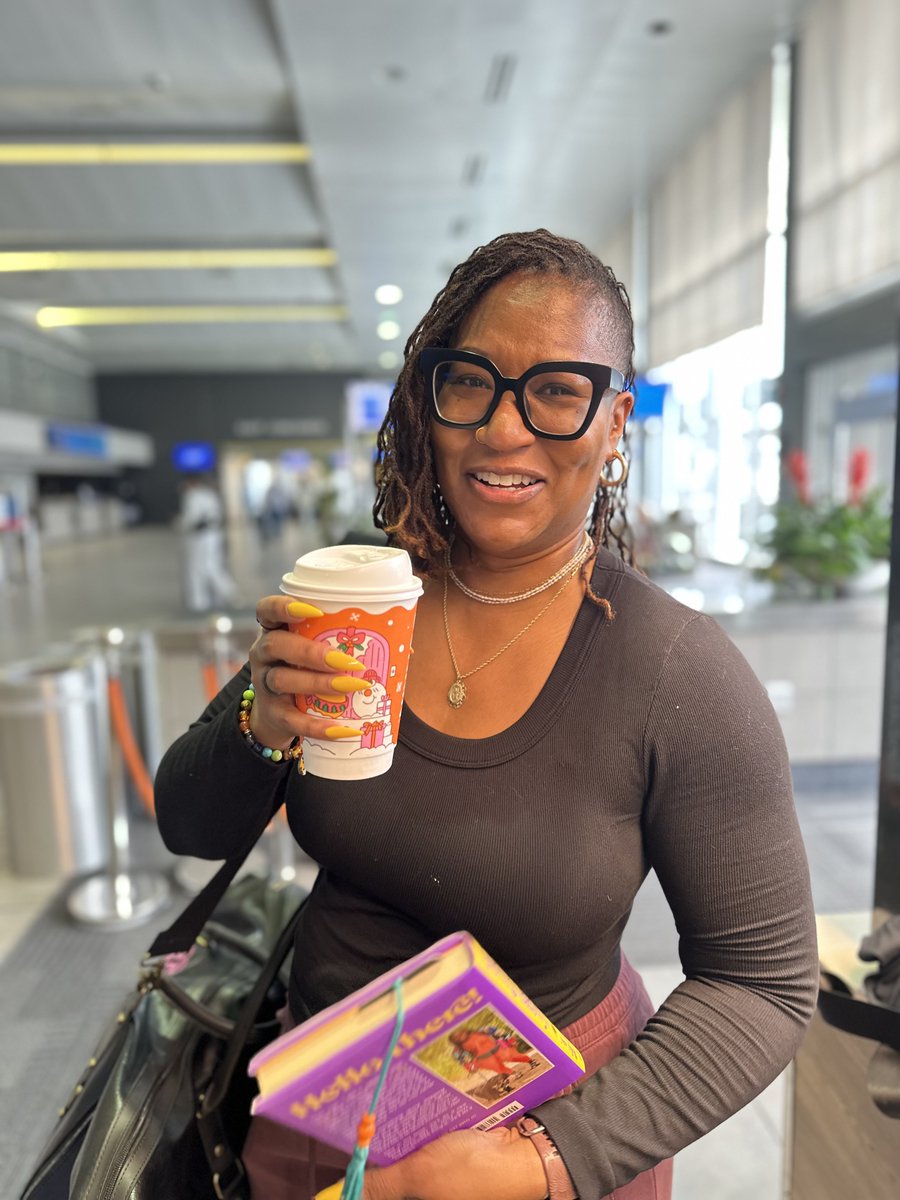 JacksonAirports's tweet photo. She’s booked. 📚✈️
Robyn, a proud Jacksonian, grabbed her favorite read, a sweet wake-me-up from Dunkin’, and took literacy to new heights at JAN.
We're bridging literacy in flight — because every journey should take you somewhere great.
#ReadAcrossAmerica #FlyJAN #BookedAtJAN https://t.co/N7YWefQBkP