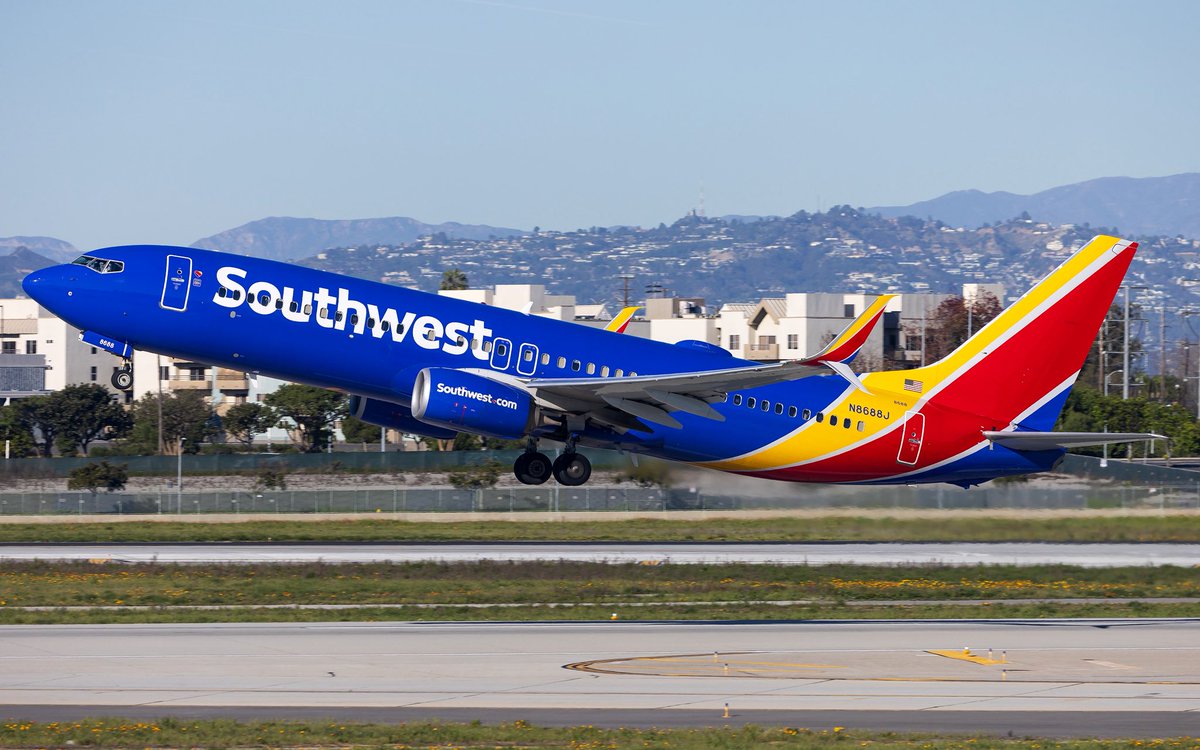 A Southwest 737-800 taking off on runway 24L at LAX.