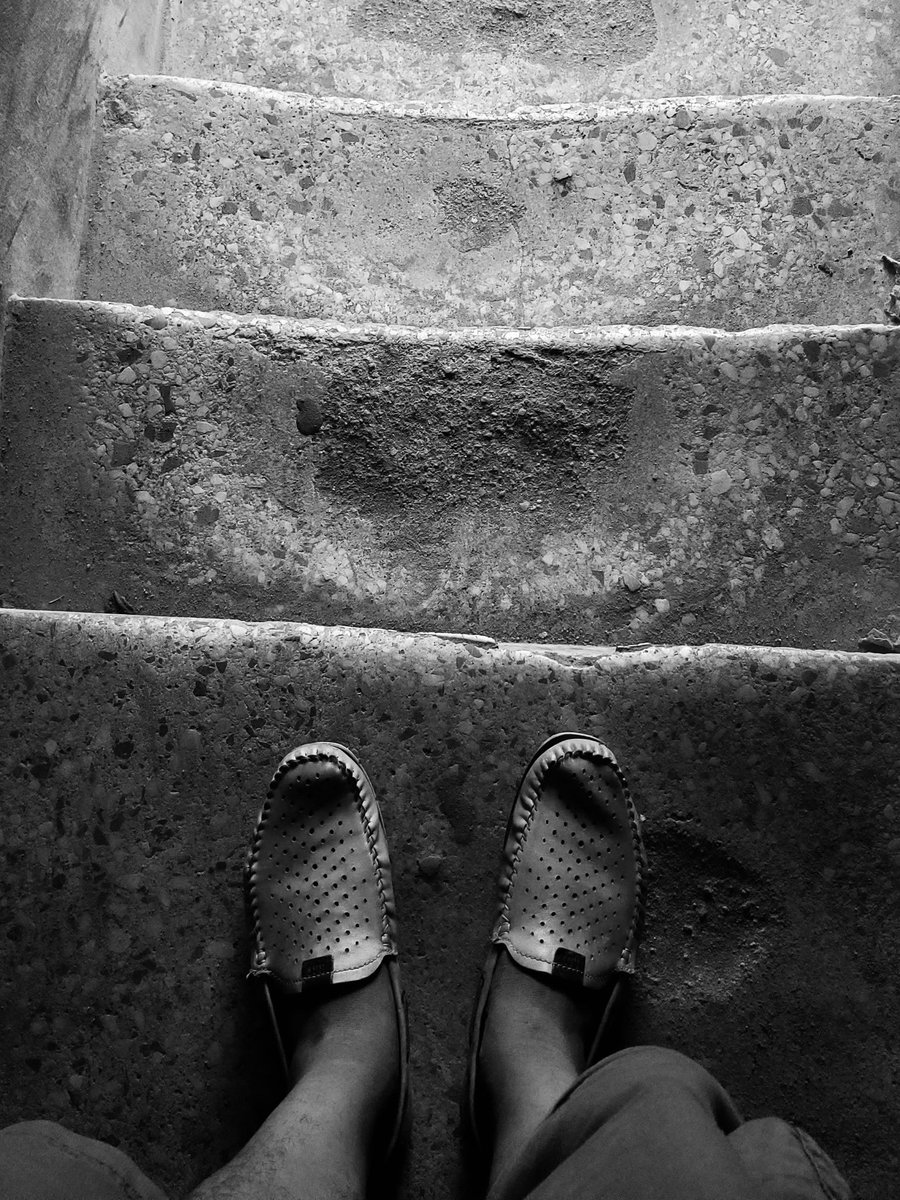 Between dust and daylight
I stand -
soles pressed to stories
these stairs have swallowed.

Each step worn thin
by a thousand quiet climbs,
each crack a reminder
that going up
is never smooth.

Still -
here I am,
balanced at the edge
of the next rise.