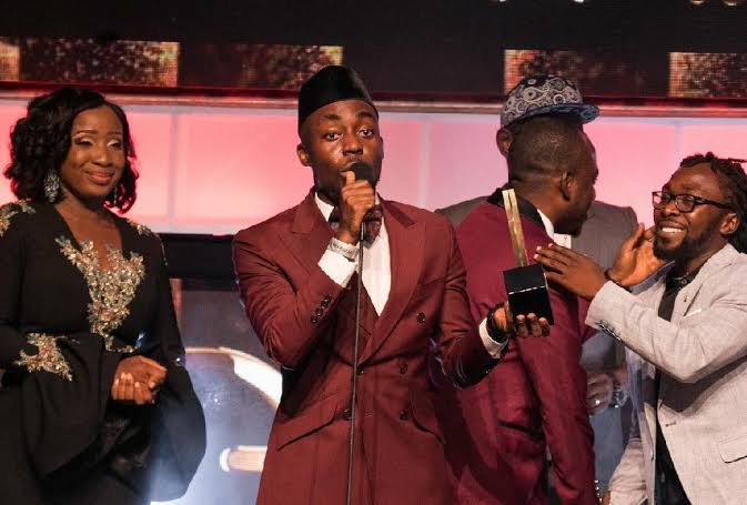 In 2018 TeePhlow blessed us witb our ONLY VGMA Record of the Year Award as produced by <a href="/ssnowbeatzGhg/">More Smoke🇬🇭</a> GhG Production. 
He beat other nominees including Kumi Guitar, Samini and Sarkodie in that category with the hit single “State of the Art.”💯🏁
