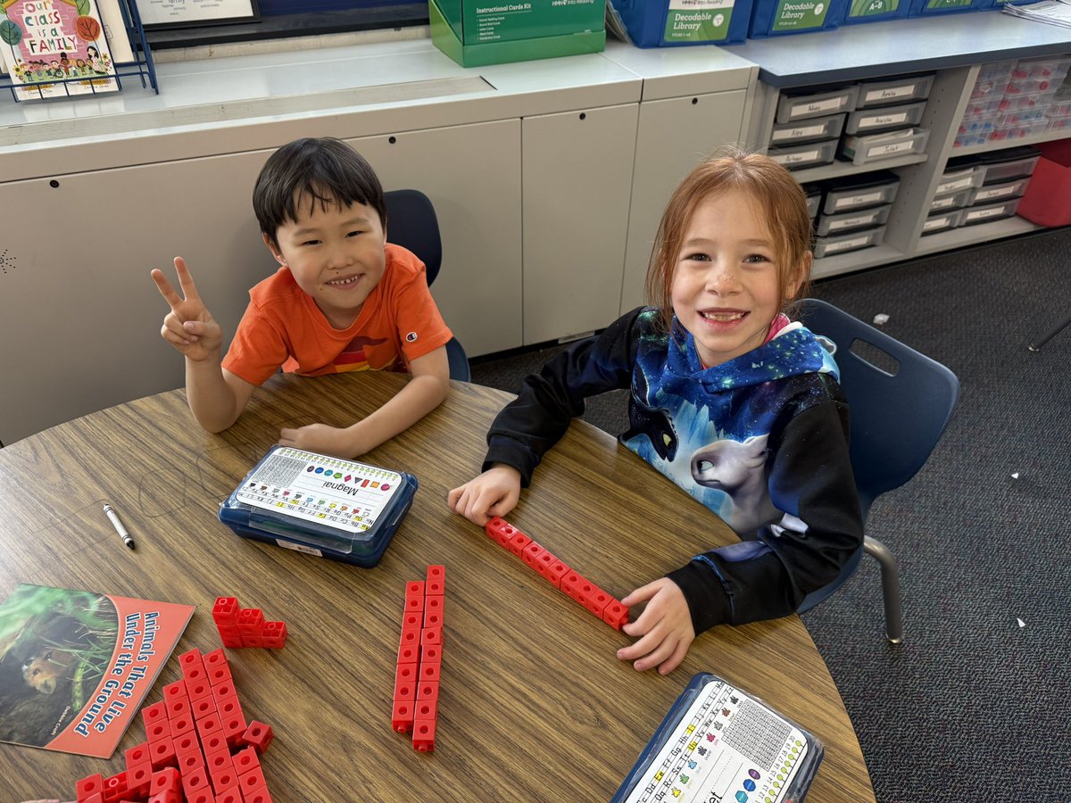 Practicing solving story problems with snap cubes!