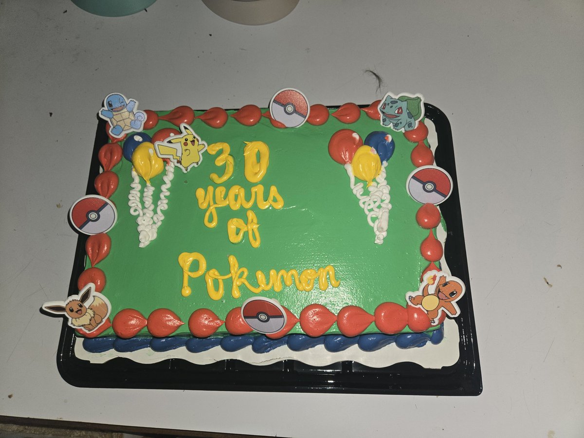 Picked up my annual #PokemonDay cake from Walmart today. I'm pleased and delighted to announce that the bakery staff added the plastic decorations entirely on their own initiative! #Pokemon30 #Pokemonday2026