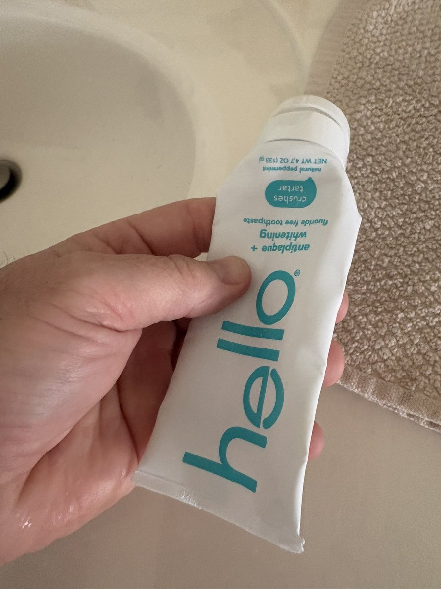 Who continues to squeeze it. 
I squeeze until my fingers hurt.  I want to use every bit before throwing it away.