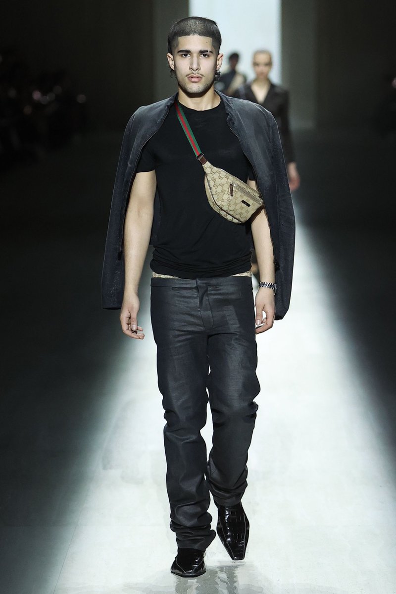 This is so reflective of how a demographic of men wear &amp; style Gucci. The Gucci crossbody, the Gucci belt, it’s jarring seeing it on a runway in Milan but it’s so meta to take how the brand is perceived and worn out in the real world and reflect that back.