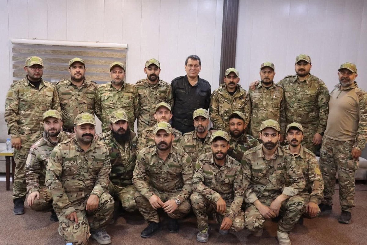 SDF Commander-in-Chief Mazloum Abdi with his brigades in Syrian Ministry of Defense uniforms

Journalist: Jiro Mitani