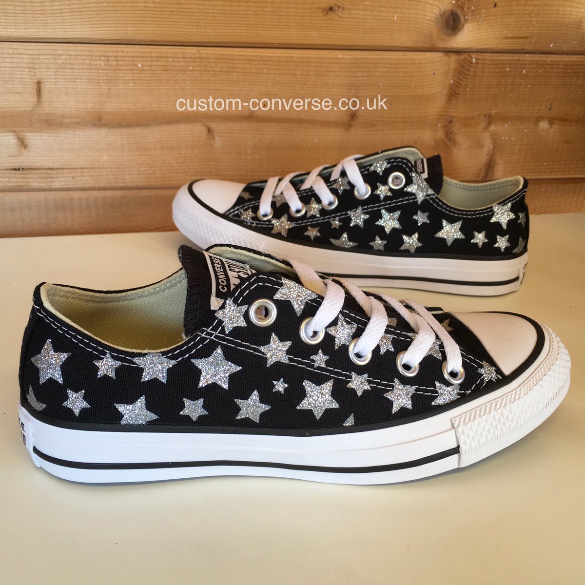 CustomConverse's tweet photo. Here are the finished Silver Glitter Stars black low top Converse. A fun, bold and very sparkly design! These are one of two pairs which were ordered together, with the idea of wearing one of each shoe together to make a mismatched pair. Can you guess what the second pair are? https://t.co/1RDuzK5ztb