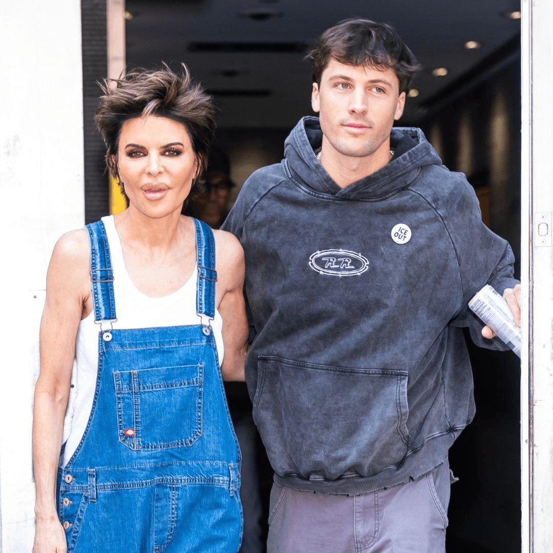 Rob Rausch wears an "ICE OUT" pin the day after the Traitors season finale.