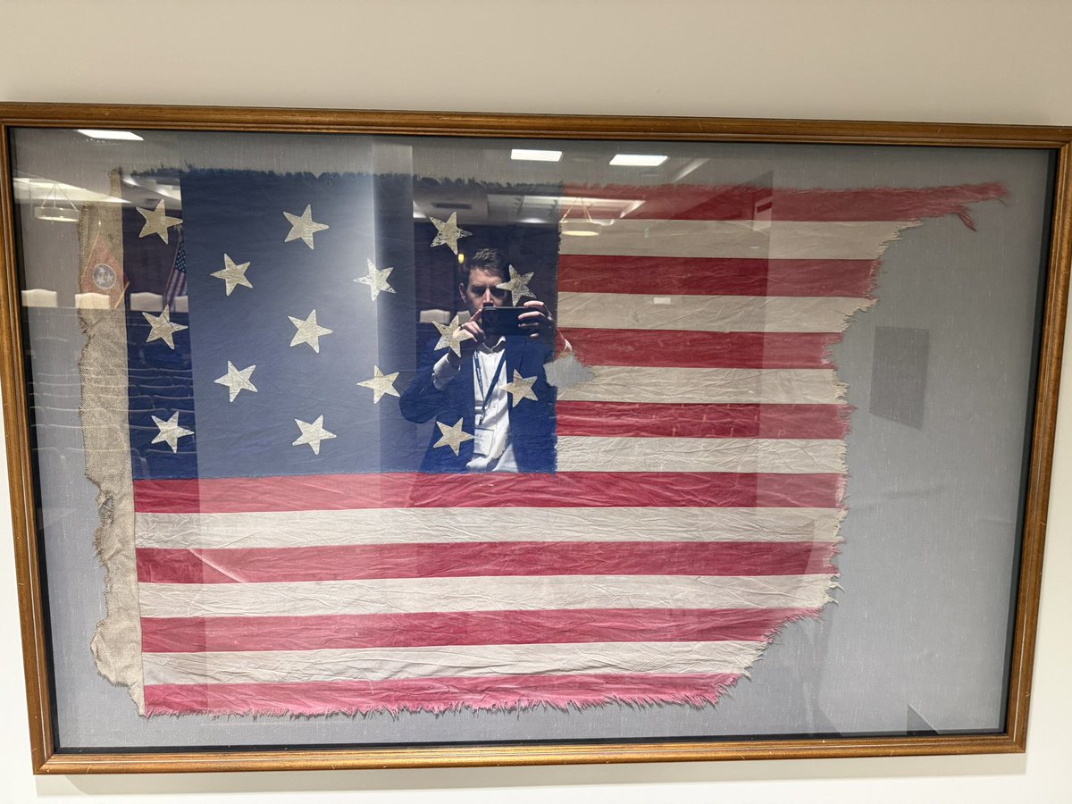 ChrisRodes3's tweet photo. Standing in awe before threads of our nation’s birth.
From the Grand Union Flag (1775–1776) that flew over Washington’s army—still bearing the Union Jack as hope lingered for peace—to the legendary Betsy Ross 13-star circle (1777), symbol of independence and equality.
Then the fierce eagle cantons of the 19th century: hand-embroidered guardians of liberty, carried by militia and patriots through wars and peace.
These tattered, preserved banners remind us: freedom was fought for, not given. Honor the flag. Honor the fight. 🇺🇸🦅 #AmericanHistory #OldGlory #RevolutionaryWar #Patriotism”