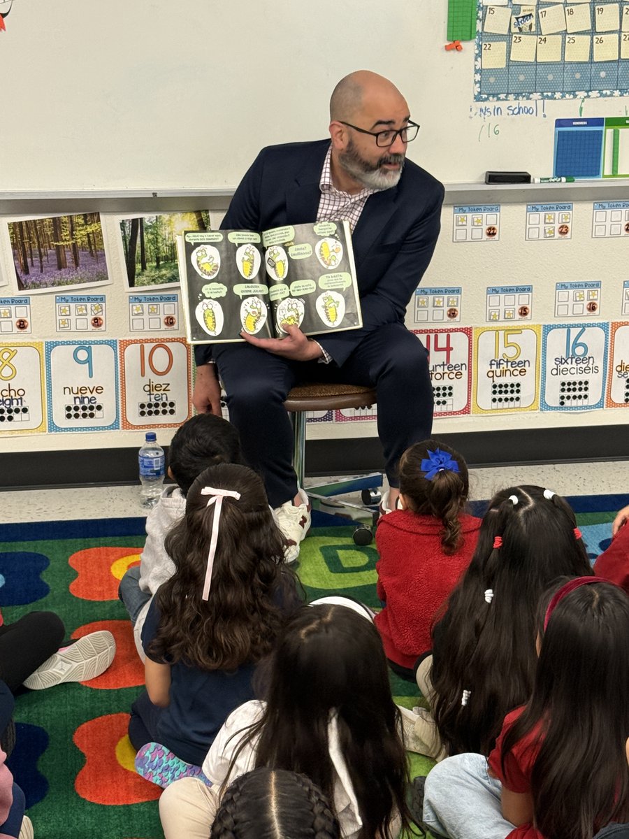 Roach_Wranglers's tweet photo. Thank you to our wonderful district leader, Mr. Ruiz, for reading to Ms. Galaviz's kindergarten class with such animation and heart! You made our Read Across America event magical! @technagogy @gisdnews @GISDREADS https://t.co/l1YXUYdMMe