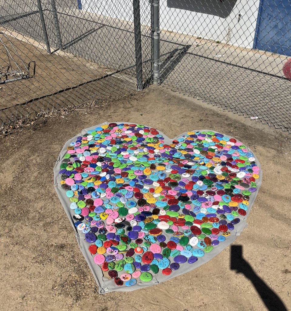 principalkirk1's tweet photo. At Mesa Grande, one of our values is to encourage positive character.  Here is our Kindness Club, making a design with rocks on which students painted positive messages, in one of our front planters.  Way to go, kiddos! https://t.co/QFASiUXmp7