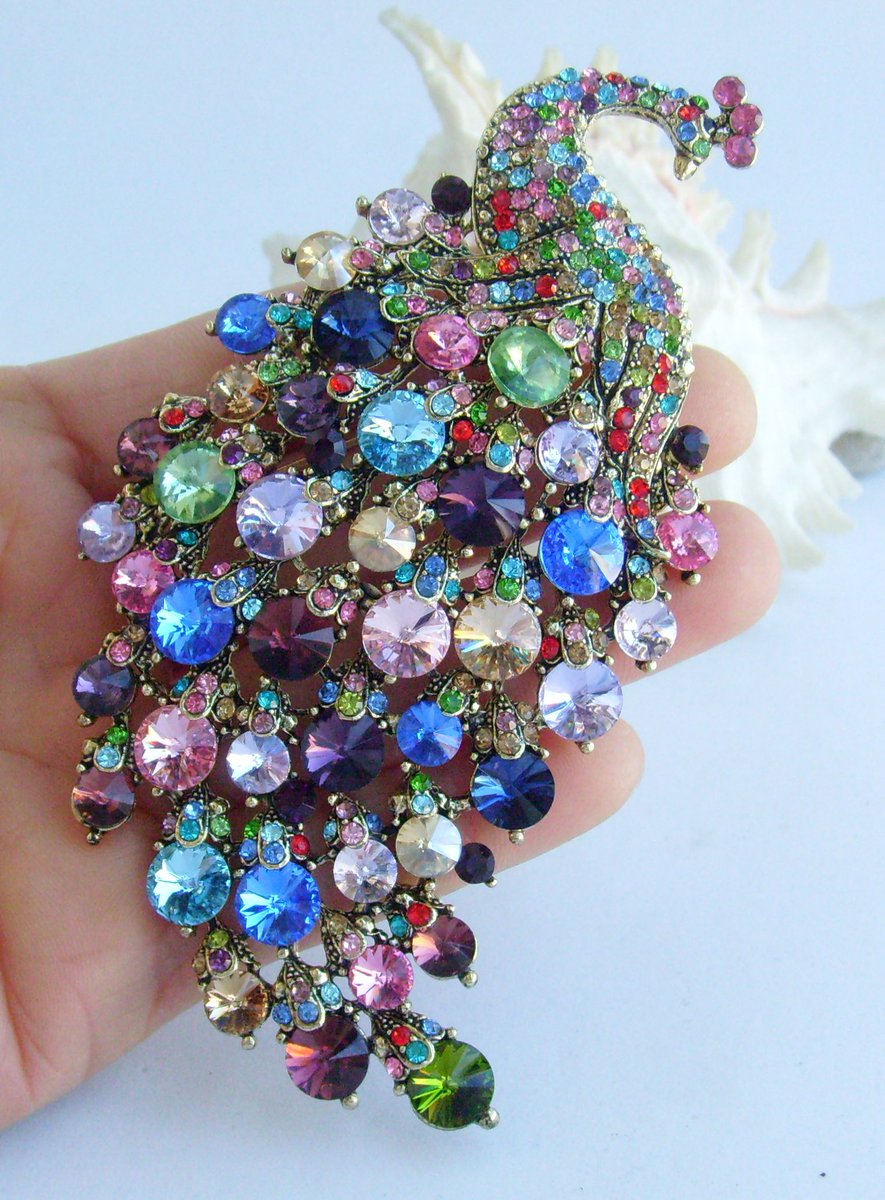 Introducing our gorgeous Peacock Brooch, adorned with rhinestone crystals. Perfect for your outfit, jacket, scarf, or even a hat. Thanks to the hook of the back that also can be use as a pendant. etsy.com/listing/432299… #PeacockBrooch #AnimalBrooch #CostumeJewelry #PeafowlBrooch