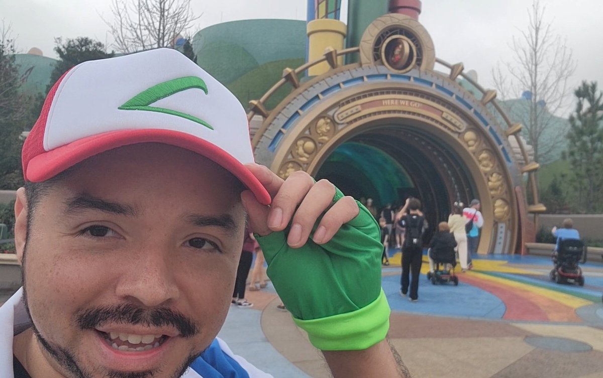 Urge2Game's tweet photo. I dressed up as Ash Ketchum in Epic Universe to celebrate #PokemonDay!!! https://t.co/yGUq9OYec6