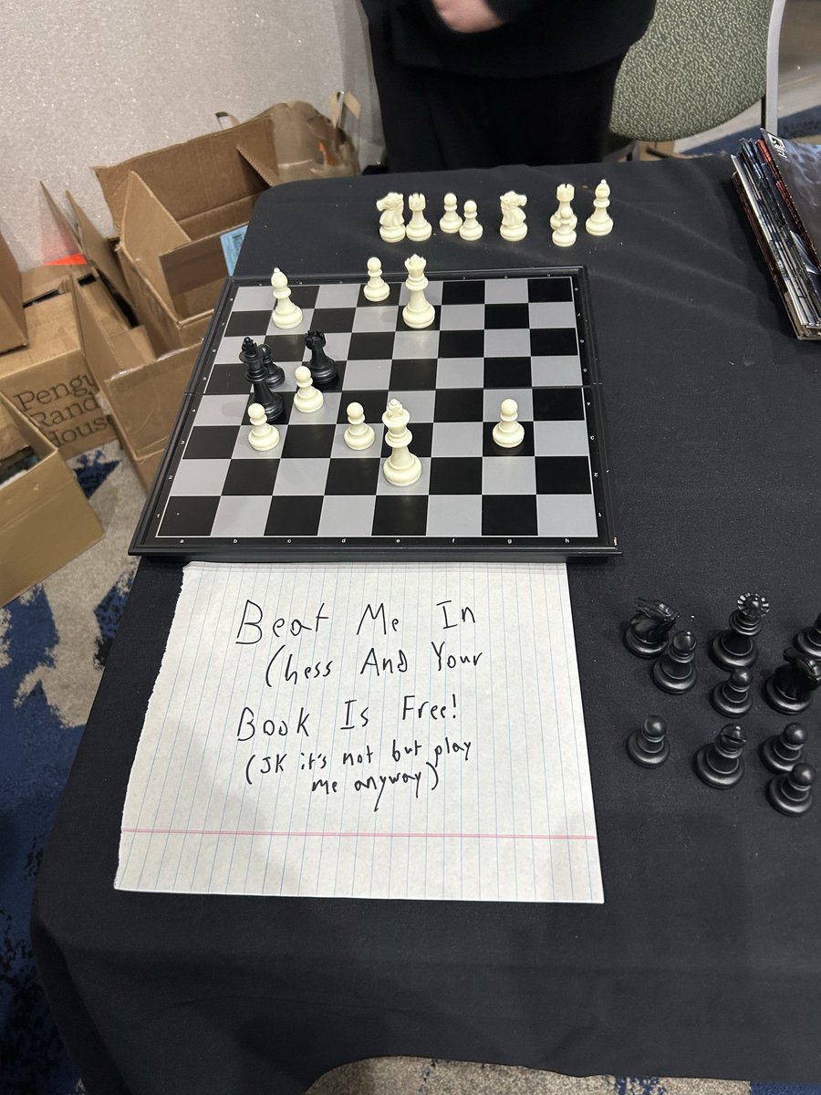 claymcleod's tweet photo. So AuthorCon started off with a bang today and I didn’t take any pictures! But I brought Jasper with me and we set up a chess set for him to challenge convention goers to play him. He’s ready to compete Saturday and Sunday… so face the master blaster! #authorcon #scaresthatcare https://t.co/PmKqn8ZN4A