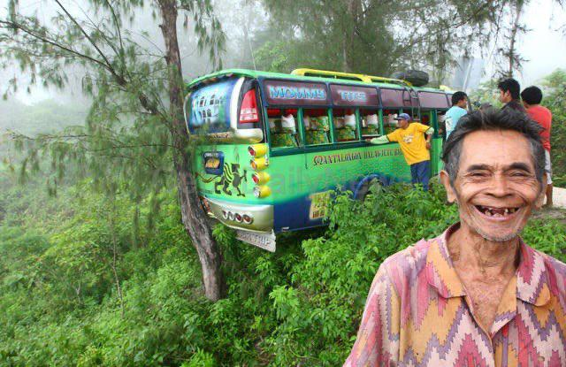 Guy smiles for a photo after the tree he planted 35 years ago that he named Epimaco Amancio saved a bus from plunging off a cliff in Dalaguete, Cebu, Philippines. 

It saved the lives of 37 people, most of them were students.