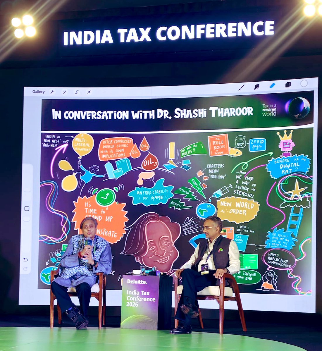ShashiTharoor's tweet photo. A quick diversion (too quick, just four hours!) to Goa to address @DeloitteIndia’s Tax Conference. Took questions on a dazzling range of issues, from geopolitics to economics to politics to what makes me tick … Great fun but all off the record! (And they drew a “mind map” on the screen behind me while I was speaking)