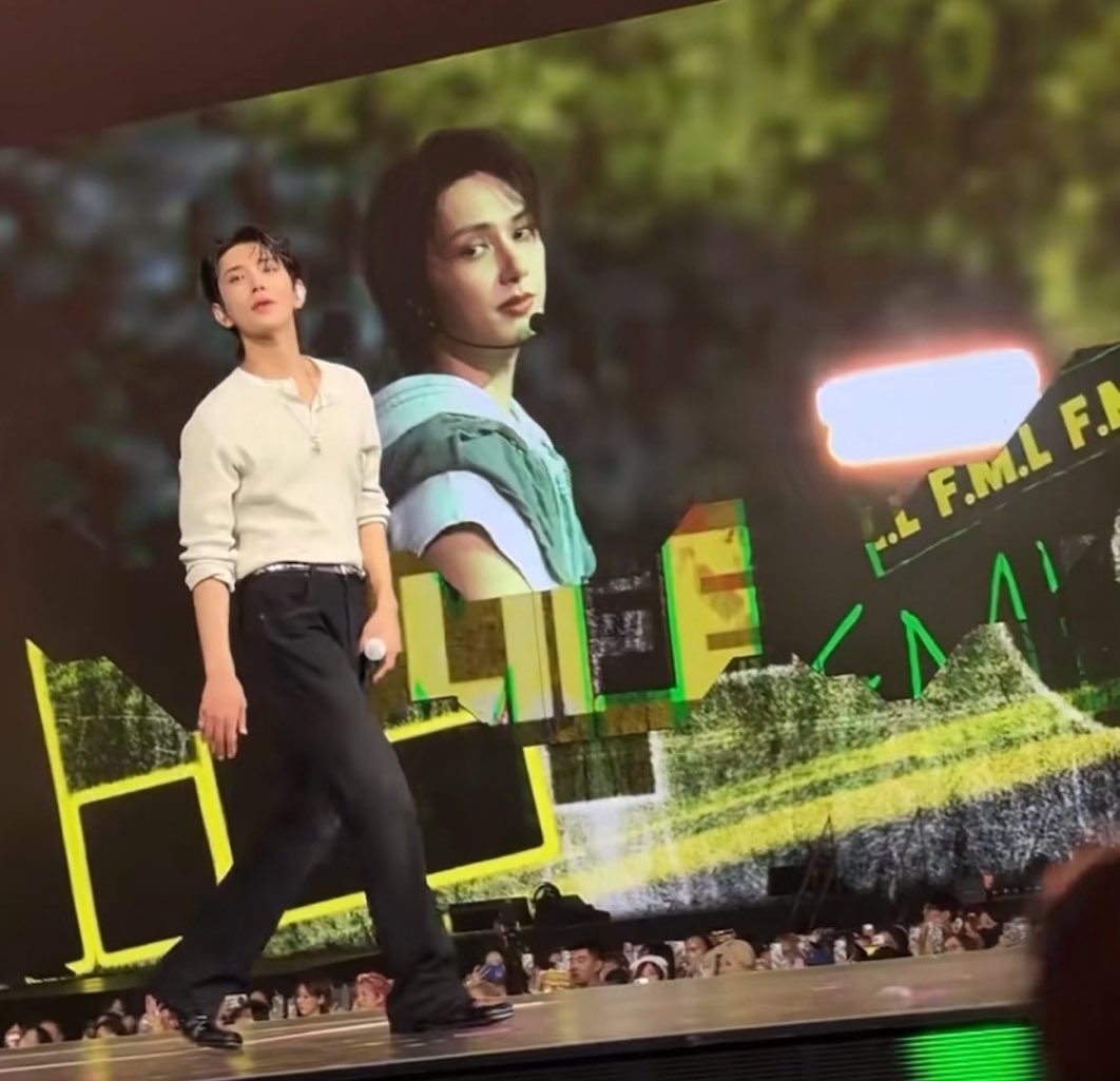 he's one less shirt away from singing eyes, nose, lips while his ex's giant photo is in the background