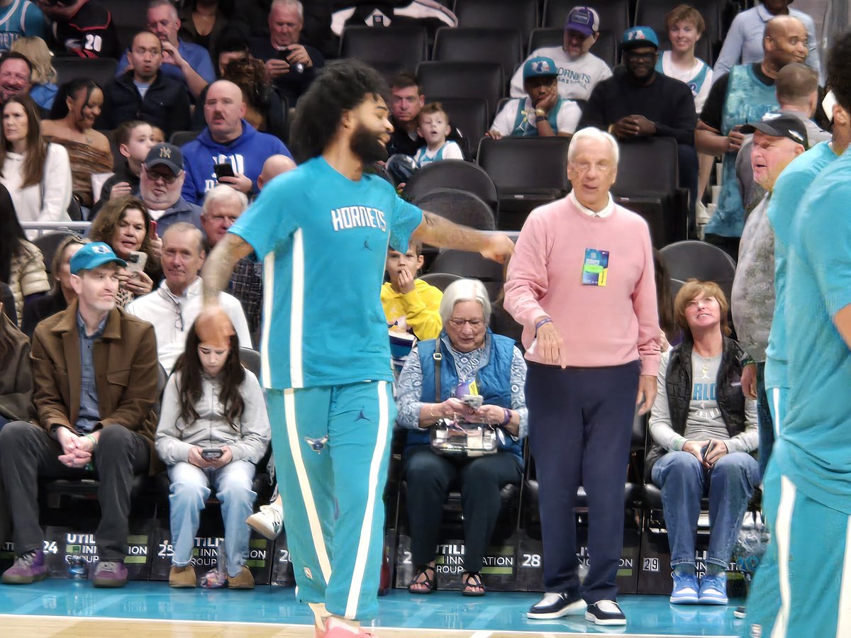 rodboone's tweet photo. Coby White's home debut with the #Hornets is so big that even Roy Williams is here sitting courtside. https://t.co/RnL2gLQnPe