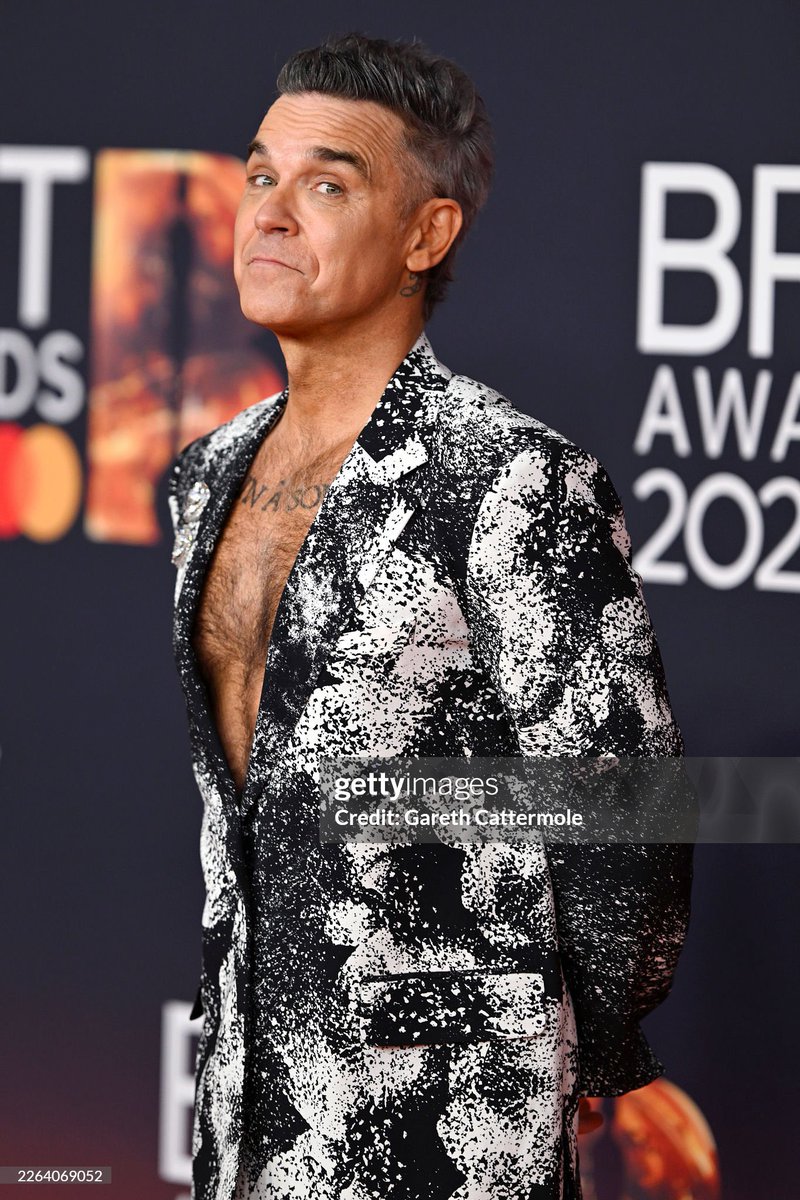 pacific_oh's tweet photo. I’m sorry, I just need to make a bed out of Robbie Williams chest #Brits2026 https://t.co/MXzfr7GvDV