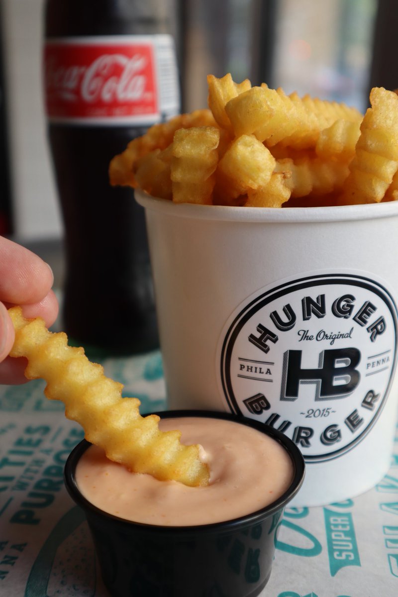 An order of fantastic fries with a side of HB Sauce...don't forget a Coke! 🍟🥤
